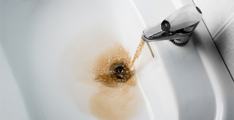 A sink with discolored water
